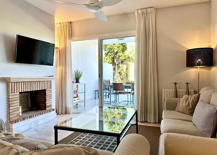 Blue House In Guadalmina Baja, With A Large Terrace Overlooking The Golf